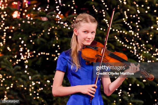 Princess Eléonore of Belgium plays the violin in a string quartet with the Scala Choir during the Christmas concert at the Royal Palace on December...