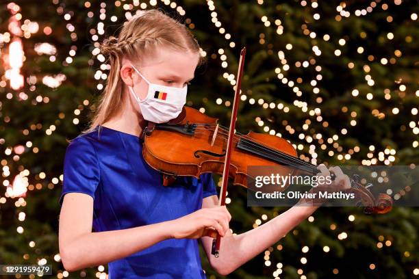 Princess Eléonore of Belgium plays the violin in a string quartet with the Scala Choir during the Christmas concert at the Royal Palace on December...