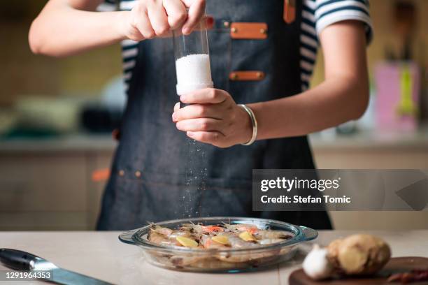 woman ordering fresh prawn for cooking in the glass bowl - pepper seasoning stock pictures, royalty-free photos & images