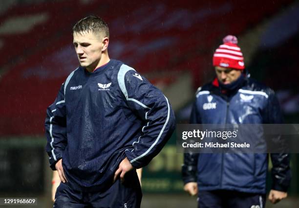 Jonathan Davies of Scarlets and coach Glenn Delaney look dejected after the Heineken Champions Pool 1 match between Scarlets and Toulon is called off...