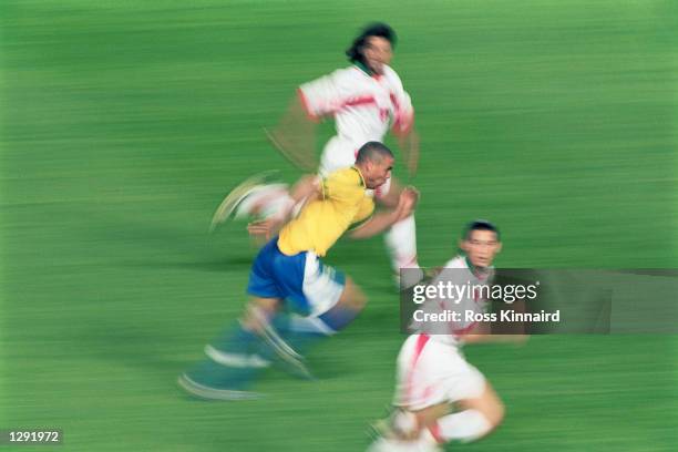 Impression of Ronaldo of Brazil terrorising the Morocco defence during the World Cup group A game at the Stade de la Beaujoire in Nantes, France....