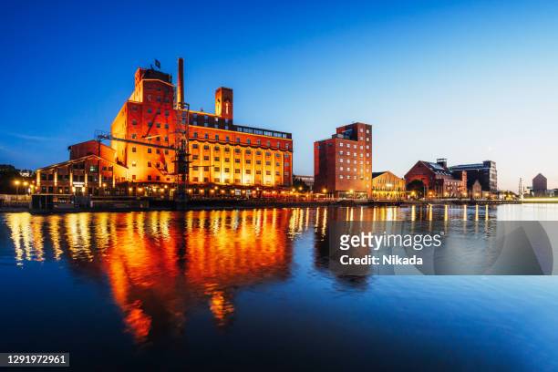 view of duisburg inner harbour at dusk - duisburg stock pictures, royalty-free photos & images