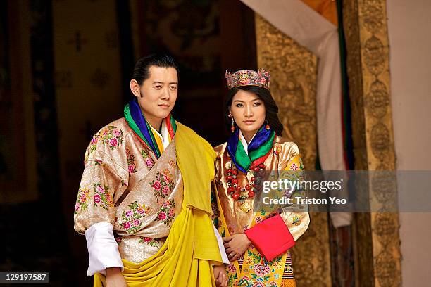 His majesty King Jigme Khesar Namgyel Wangchuck and Queen Jetsun Pema walk out after their marriage ceremony is completed on October 13, 2011 in...