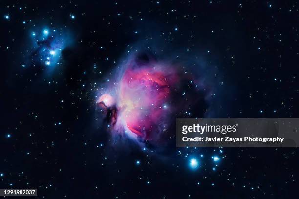 orion nebula (m42 - messier 42) - copy space stock pictures, royalty-free photos & images