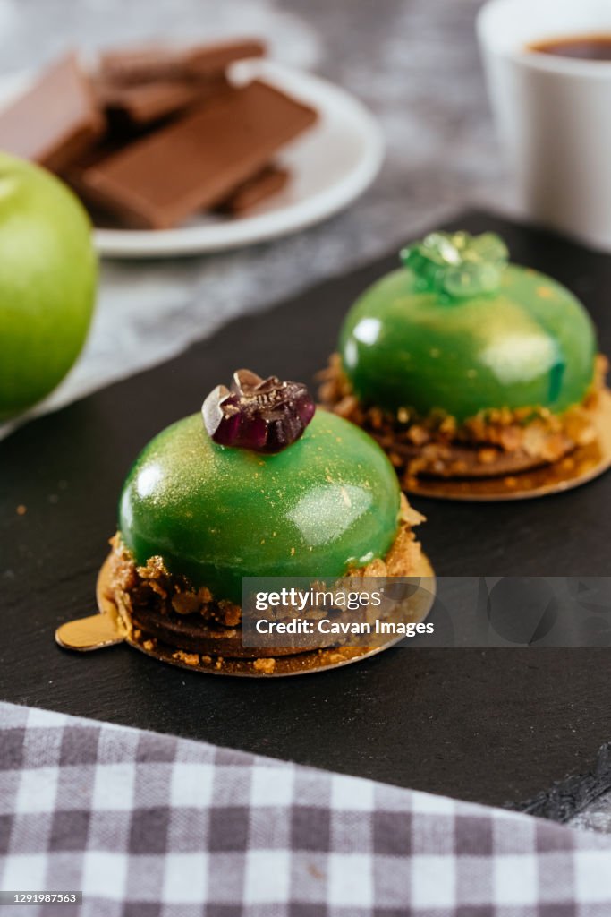 A variety of sweet homemade desserts on a light marble backgroun