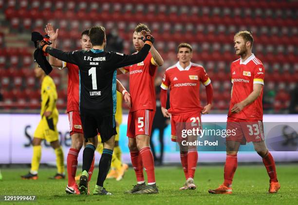Robin Knoche, Andreas Luthe, Marvin Friedrich , Grischa Promel and Sebastian Griesbeck of 1.FC Union Berlin celebrate victory after the Bundesliga...