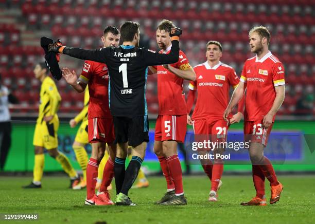 Robin Knoche, Andreas Luthe, Marvin Friedrich , Grischa Promel and Sebastian Griesbeck of 1.FC Union Berlin celebrate victory after the Bundesliga...