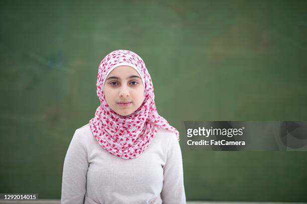 portrait of muslim school girl - afghan girl stock pictures, royalty-free photos & images
