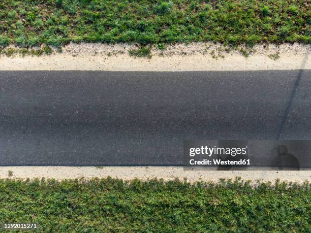 aerial view of empty asphalt road - asphalt stock pictures, royalty-free photos & images