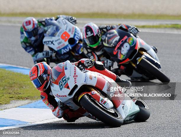 Kalex rider Stefan Bradl of Germany sets the fastest lap time ahead of Aleix Espargaro of Spain and Kenny Noyes of the US during the second practice...