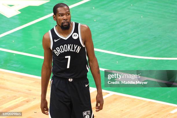 Kevin Durant of the Brooklyn Nets looks on during the preseason game between the Nets and the Boston Celtics at TD Garden on December 18, 2020 in...