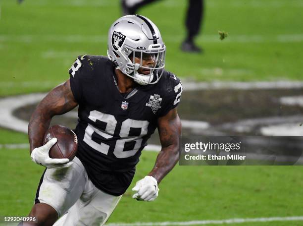 Running back Josh Jacobs of the Las Vegas Raiders runs against the Los Angeles Chargers in the second half of their game at Allegiant Stadium on...