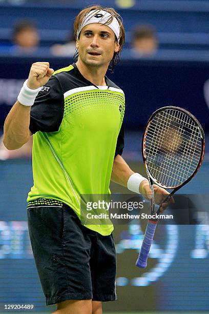 David Ferrer of Spain celebrates match point against Andy Roddick of the United States during the Shanghai Rolex Masters at the Qi Zhong Tennis...