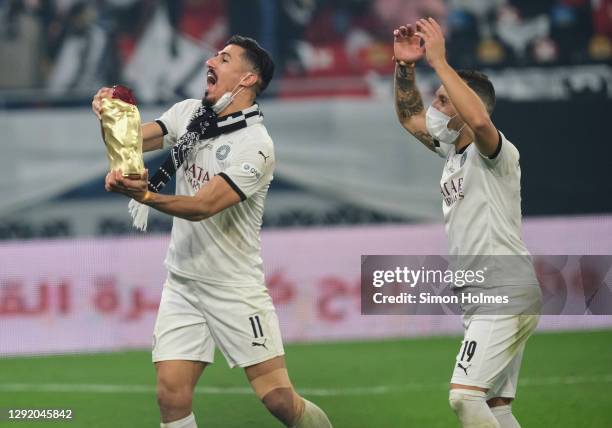 Baghdad Bounedjah and Santi Cazorla of Al Sadd celebrate after winning the Emir Cup over Al Arabi at Al Rayyan Stadium on December 18, 2020 in Doha,...