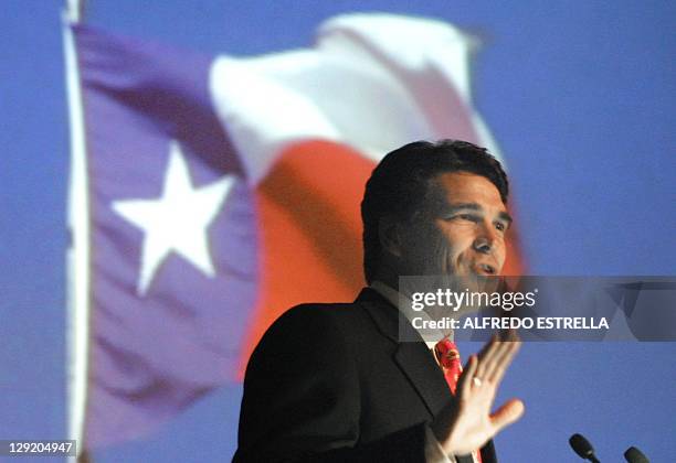 Texas Governor Rick Perry is seen speaking to an audience reagarding the Panamerican games in Mexico City 24 August 2002. El gobernador de Texas,...