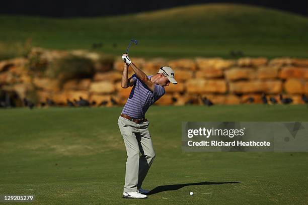Rhys Davies of Wales plays into the 18th green during the second round the Portugal Masters at Oceanico Victoria Golf Course on October 14, 2011 in...