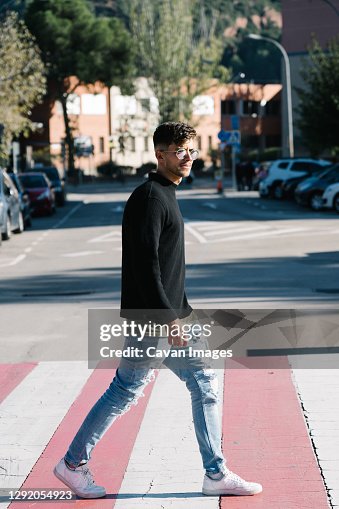 Premium Vector  Boy crossing the road at zebra crossing