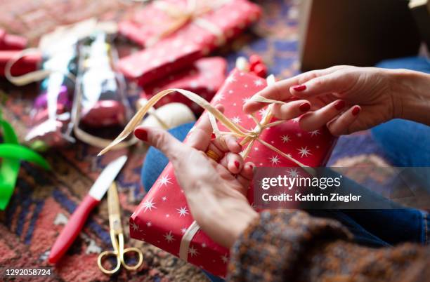 woman wrapping gifts, close-up of hands - wrapping stock pictures, royalty-free photos & images