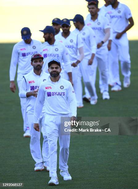 Virat Kohli of India leads his team shake hands after their loss during day three of the First Test match between Australia and India at Adelaide...