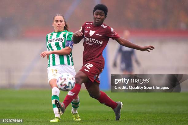 Nuria Ligero Nana of Real Betis competes for the ball with Asantewaa of EDF Logroño during the Primera Iberdrola match between Real Betis Feminas and...