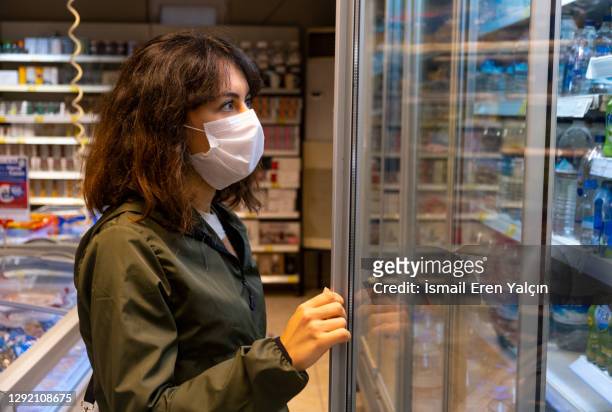 masked woman shopping at the pandemic - scuba mask stock pictures, royalty-free photos & images