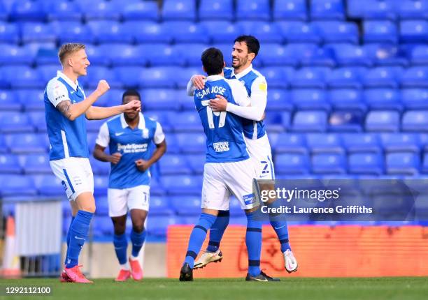 Maxime Colin of Birmingham City celebrates with teammates Mikel San Jose and Kristian Pedersen after scoring his team's first goal during the Sky Bet...