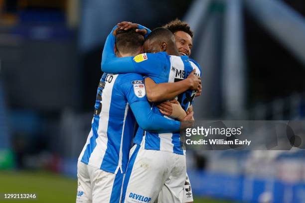 Ramani Edmonds-Green of Huddersfield Town celebrates with Isaac Mbenza and Juninho Bacuna during the Sky Bet Championship match between Huddersfield...