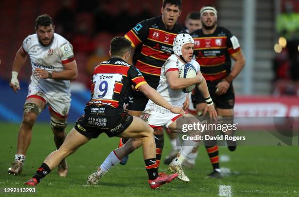 Michael Lowry of Ulster goes past Charlie Chapman during the Heineken Champions Cup Pool 2 match at Kingsholm Stadium on December 19, 2020 in...
