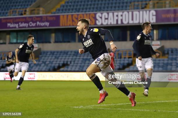 Tom Bradshaw of Millwall celebrates after scoring their team's first goal during the Sky Bet Championship match between Millwall and Nottingham...