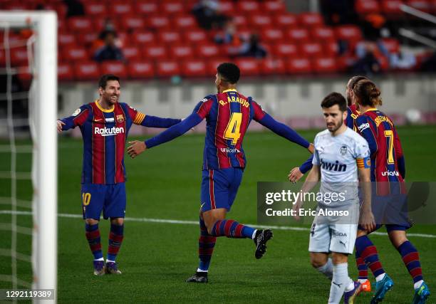 Ronald Araujo of Barcelona celebrates with Lionel Messi after scoring their team's second goal during the La Liga Santander match between FC...