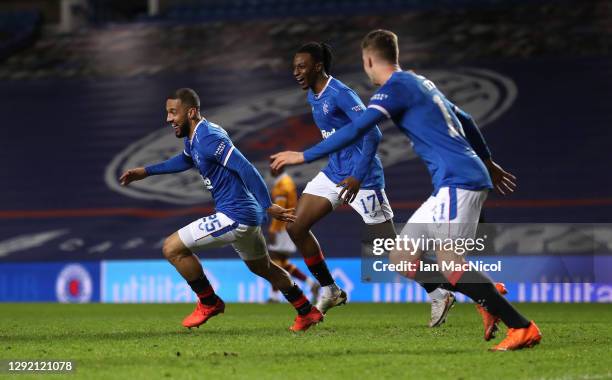 Kemar Roofe of Rangers celebrates with teammate Joe Aribo after scoring their team's third goal during the Ladbrokes Scottish Premiership match...