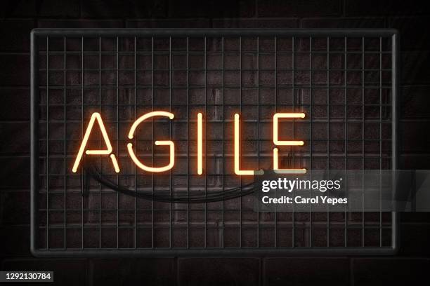 agile single word in neon lights - tech scrum stock pictures, royalty-free photos & images