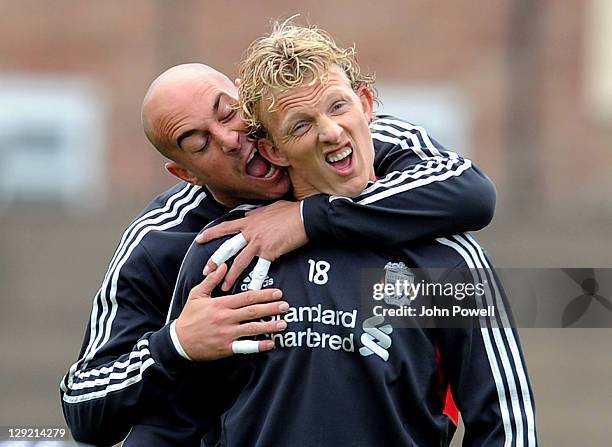 Pepe Reina jokes about with Dirk Kuyt of Liverpool during a training session at Melwood Training Ground on October 14, 2011 in Liverpool, England.