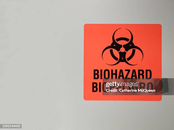 caution: medical biohazard warning label - biohazard symbol stock pictures, royalty-free photos & images