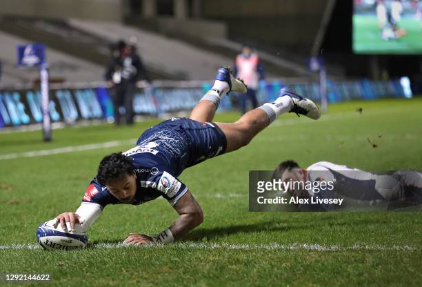 Denny Solomona of Sale Sharks dives over the line to score the opening try during the Heineken Champions Cup Pool 1 match between Sale and Edinburgh...