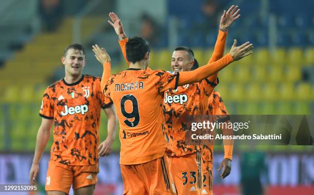 Alvaro Morata of Juventus F.C. Celebrates with Federico Bernardeschi and teammates after scoring their team's fourth goal during the Serie A match...