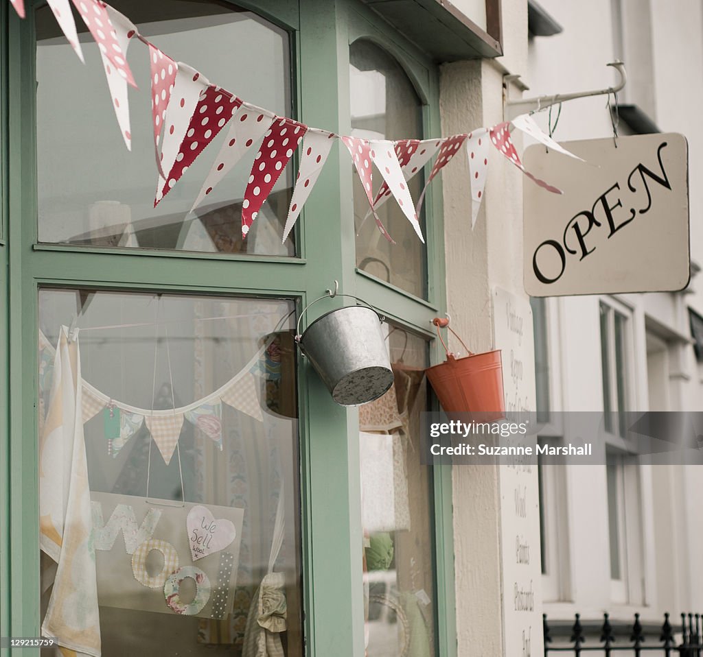 Bunting outside shop window