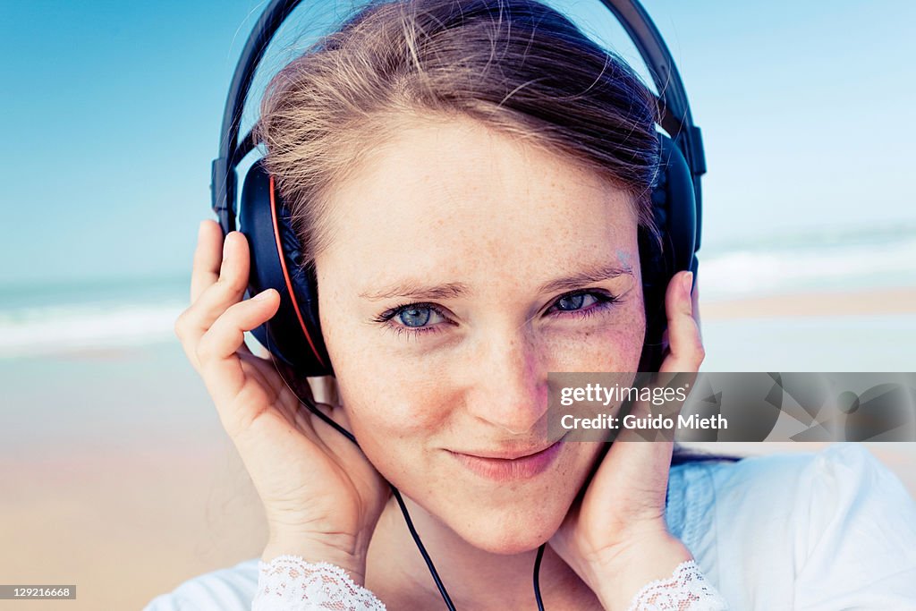 Portrait of young women listen to music