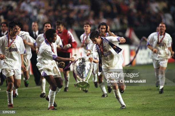 Real Madrid celebrate with the trophy after the Champions League final against Juventus at the Amsterdam Arena in Holland. Real Madrid won the match...