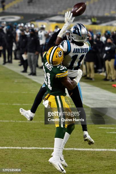 Wide receiver Robby Anderson of the Carolina Panthers has a pass broken up by strong safety Adrian Amos of the Green Bay Packers in the fourth...