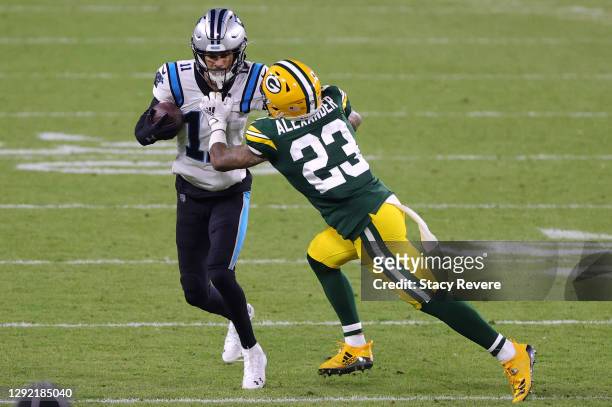 Wide receiver Robby Anderson of the Carolina Panthers is tackled cornerback Jaire Alexander of the Green Bay Packers in the fourth quarter of the...