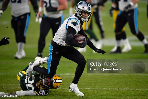 Wide receiver Robby Anderson of the Carolina Panthers rushes for a first down ageist the Green Bay Packers in the third quarter of the game at...