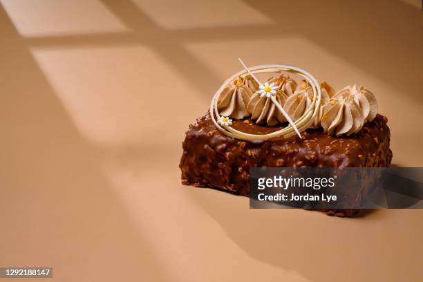 lemon praline rectangular cake - dark chocolate mousse stock pictures, royalty-free photos & images