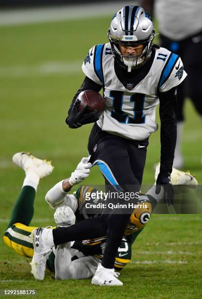 Wide receiver Robby Anderson of the Carolina Panthers rushes for a first down ageist the Green Bay Packers in the third quarter of the game at...