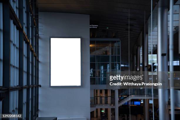 mock up of vertical blank advertising billboard or light box showcase with waiting cone at airport, copy space for your text message or media content, advertisement, commercial and marketing concept - plakat mock up stock-fotos und bilder