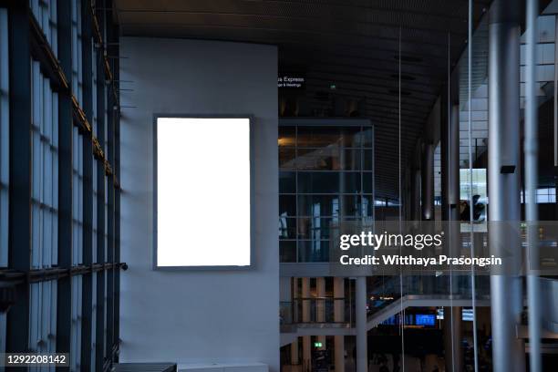 mock up of vertical blank advertising billboard or light box showcase with waiting cone at airport, copy space for your text message or media content, advertisement, commercial and marketing concept - billboard mockup stock pictures, royalty-free photos & images