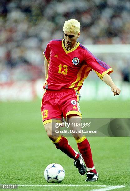 Liviu Ciobotariu of Romania on the ball during the World Cup group G game against Tunisia at the Stade de France in St Denis, France. The match ended...