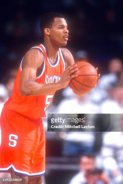 Lucious Jackson of the Syracuse Orange looks to pass the ball during a college basketball game against the Georgetown Hoyas on February 7, 1994 at...