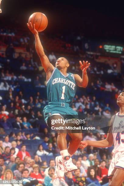 Muggsy Bogues of the Charlotte Hornets drives to the basket during a NBA basketball game against the Washington Bullets at Capital Centre on December...