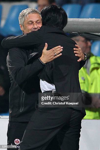 Head coach Armin Veh embraces sporting director Bruno Huebner of Frankfurt after winning 2-0 the Second Bundesliga match between VfL Bochum and...